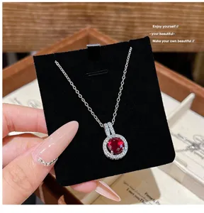 Exquisite red gemstone halo necklace pendant detailed view, sparkling zircon chain for women.
