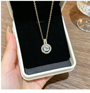 Close-up of a sparkling round zircon gold necklace pendant showcasing delicate crystal details.