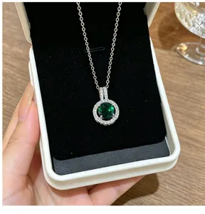 Detailed close-up view of the elegant round green zirconia rhinestone halo pendant necklace.