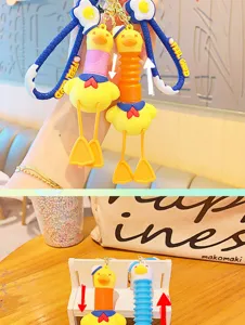 Detail view of cute sailor duck telescopic keychain, PVC cartoon pendant for schoolbag decoration.