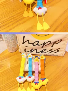 Cute sailor duck telescopic keychain detail, colorful PVC backpack pendant toy for gifts.