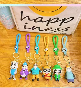 Cute Chinese style panda family keychains with colorful braided straps for bag and car decoration.
