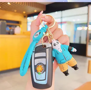 Detailed view of the cute panda keychain accessory, featuring a 3d figure and silicone strap.