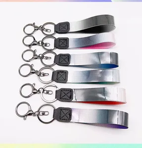 Gradient woven strap keychain set featuring metal lobster clasp and durable leather connector.