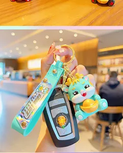 Cute dragon keychain with gold ingot and green strap, perfect year of the dragon gift.