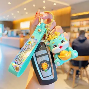 Cute cartoon dragon keychain with silicone strap, lucky charm bag pendant for car keys.