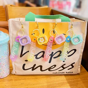 Cute mini luminous TV keychain pendant, colorful cartoon silicone strap bag charm gift.