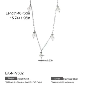 Stainless steel freshwater pearl station necklace with 18K gold PVD plating, elegant jewelry.
