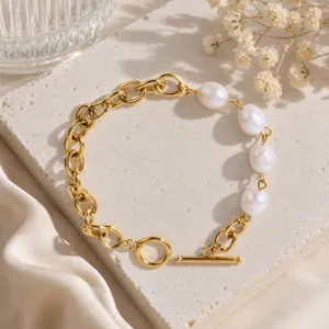 Elegant gold-plated chain bracelet featuring natural freshwater pearls and a secure toggle clasp.
