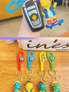 Schattige cartoon dinosaurus sleutelhanger met geweven band en metalen ring voor tas en sleutels.