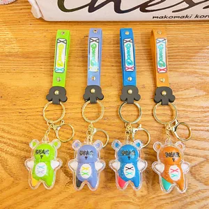 Schattige cartoon beer sleutelhanger set met kleurrijke band en metalen ring, trendy cadeau.