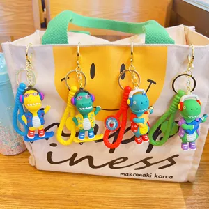 Leuke trendy dinosaurus sleutelhangers met koptelefoon gitaar kleurrijke tasbedels.