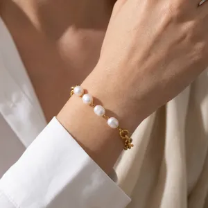 Elegant freshwater pearl chain bracelet detail shot, 18K gold plated titanium steel daily wear.