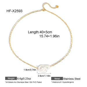 Detailed view of gold stainless steel paperclip chain necklace with baroque pearl pendant.
