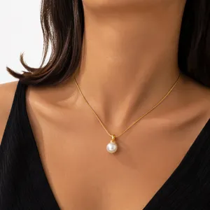 Elegant gold chain necklace featuring a single white imitation pearl pendant for women.