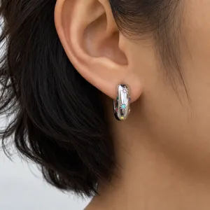 Close-up of a stainless steel hoop earring featuring colorful sparkling zircon stones for daily wear.