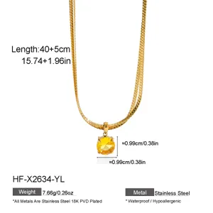 Close-up detail of double layer gold snake chain necklace with yellow zircon pendant spec.