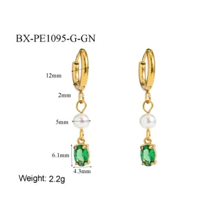 Detail view of gold stainless steel hoop earrings featuring freshwater pearl and green zircon.