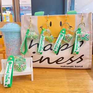 Green quicksand oil floating keychain cute bag pendant creative key ring accessory for backpack.