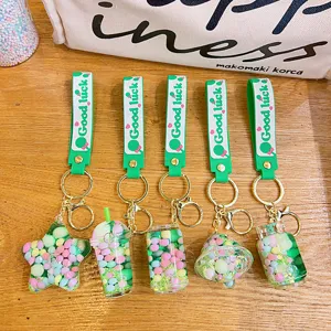 Green liquid floating glitter keychains cute bag charms set of five pieces for backpack.