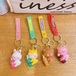 Mignon porte-clés de dessin animé animal avec bouteille de soda pour décoration de sac.