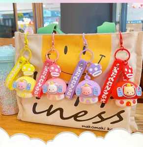 Cute mushroom house keychain with colorful strap and animal pendant for bags and keys.