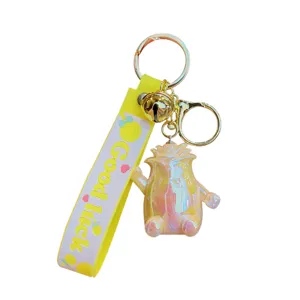 Cute holographic bear keychain with yellow strap and bell, stylish bag and car charm.