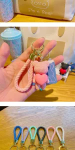 Cute love bear keychain detail view, resin doll charm with braided strap and metal ring.