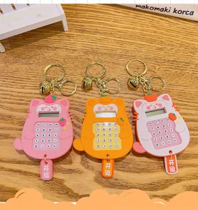 Cute cat calculator keychain with fruit design, portable silicone cartoon pendant gift.