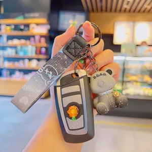 Cute cartoon bear keychain with car key cover and stylish strap pendant for daily bags.