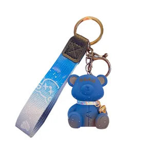 Blue cartoon bear keychain with gradient strap and metal ring, cute bag pendant accessory.