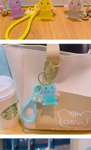 Cute translucent rabbit keychain toy with silicone strap for backpacks and car keys.
