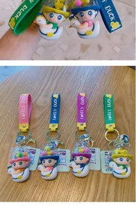 Cute cartoon duck keychain detail view, showing soft PVC material and vibrant colors perfectly.