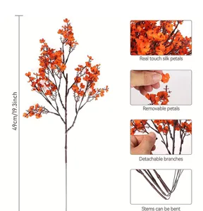 Detail view of artificial plum blossom branch showing bendable stems and realistic silk petals.