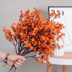 Artificial orange flower bouquet detail, perfect for home decor and vase arrangement.