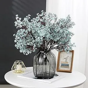 Artificial blue baby's breath flowers bouquet with dark gray glass vase for home decor.