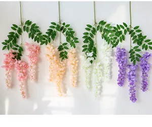 Artificial wisteria hanging vine flowers simulation silk floral decor detail shot for wall backdrop.