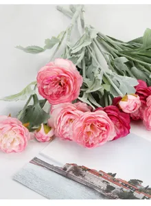 Artificial ranunculus flower bouquet detail view for home living room table decoration