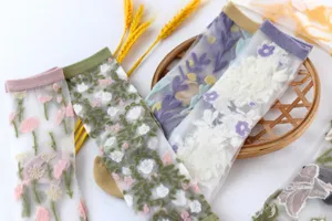 Sheer floral embroidered mid-tube women socks, lightweight summer fashion detail view.