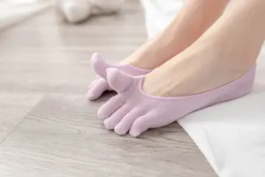 Close-up of women's soft cotton five-toe invisible boat socks in light purple tone.