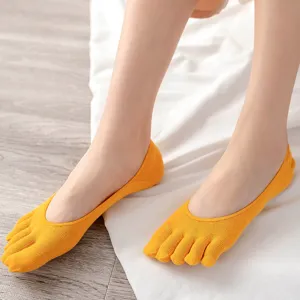 Comfortable yellow five-toe socks for women, breathable cotton invisible design.