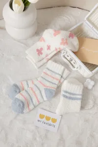 Fuzzy coral fleece mid-calf socks for women, cozy warm winter floor socks with cute patterns.