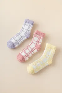 Cozy fuzzy plaid coral fleece women winter warm floor socks in purple, pink and yellow.