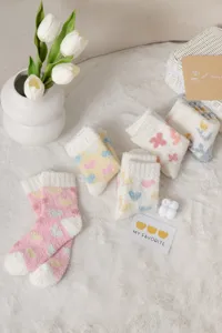 Cozy fluffy fleece winter socks detail showing soft coral velvet warm home floor socks designs.