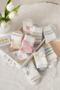 Cozy fuzzy fleece winter mid-tube socks for women, cute heart and star patterns, soft floor socks.