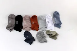 Detail view of men short cotton boat socks in various colors, breathable mesh design for summer.
