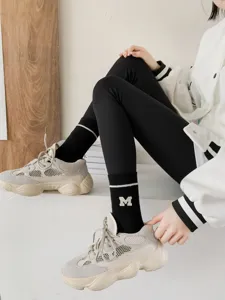 Thickened black winter fleece-lined mid-tube socks with stylish letter M design for women.