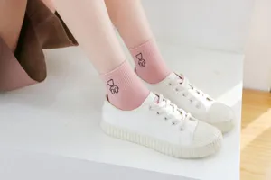 Detailed view of women pink cotton socks featuring cute embroidered bear design, soft and sweet.