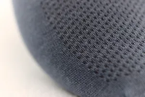 Detailed macro close-up of dark grey men's breathable mesh socks knit fabric texture.