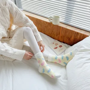 Cozy coral fleece mid-calf socks for women with colorful abstract spots and soft fuzzy warm.